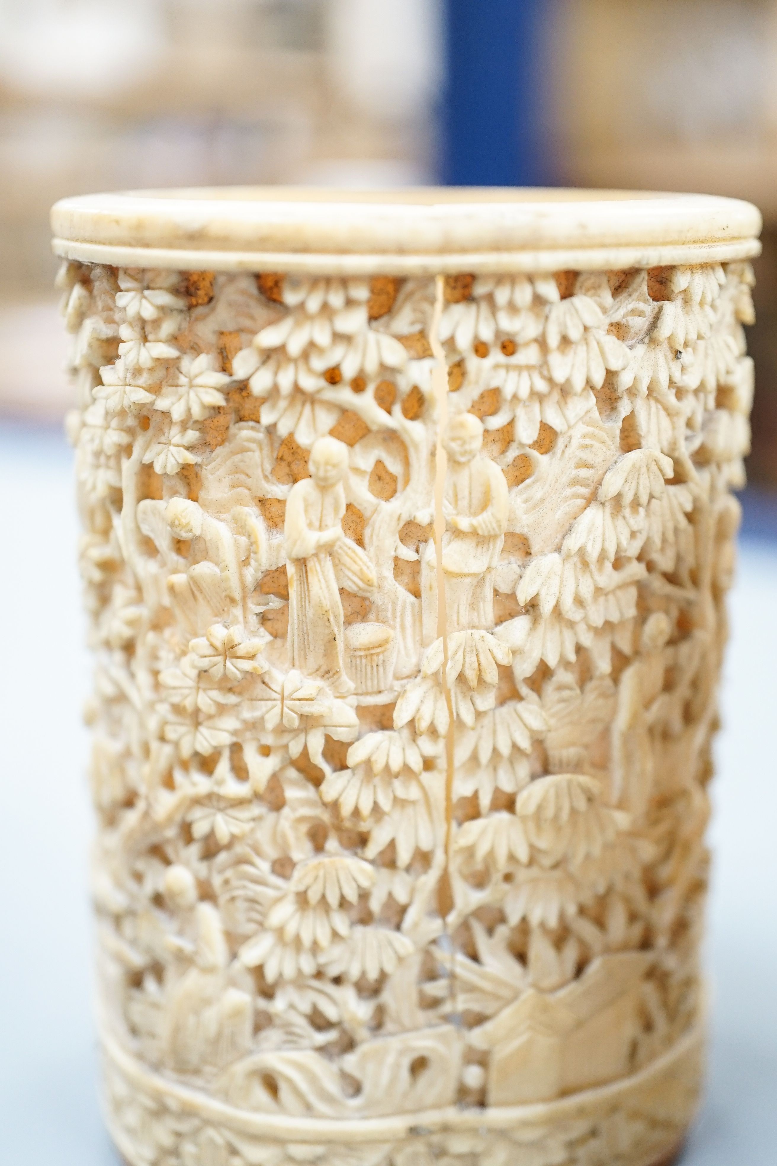 A pair of Chinese carved ivory pots and a Chinese ivory circular box and cover, 19th century
